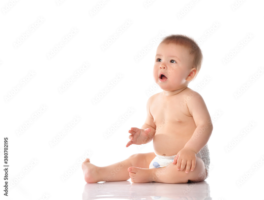 Cute little baby in diaper clapping hand on floor Cute little baby in diaper clapping hand on floor