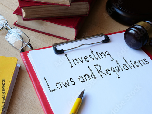 Investing Laws and Regulations is shown on the conceptual business photo