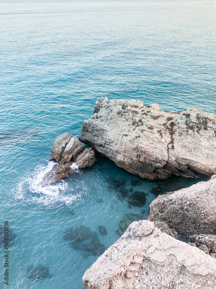 Rock in turquoise mediterranean sea