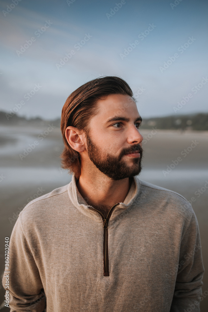 Handsome Man on Beach Looking to Side Handsome Man on Beach Looking to Side