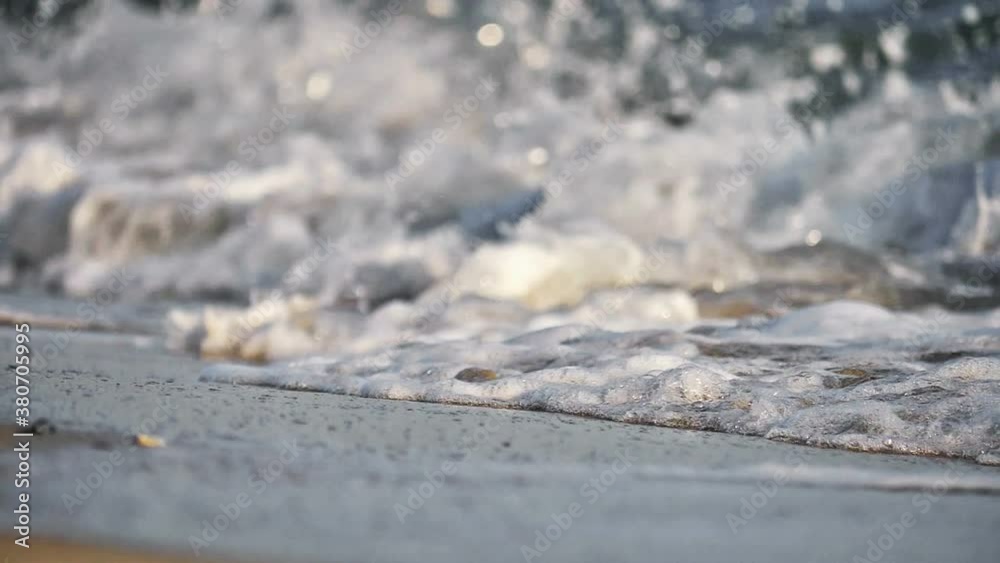 beach wave splashing macro in sunset beach wave splashing macro in sunset