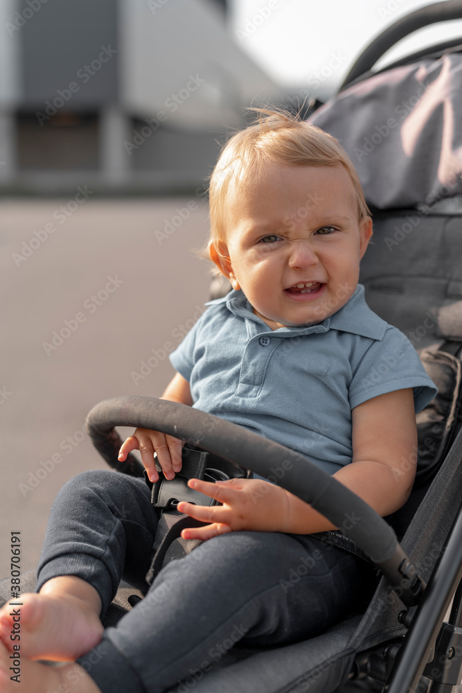 Baby sitting in a stroller Baby sitting in a stroller