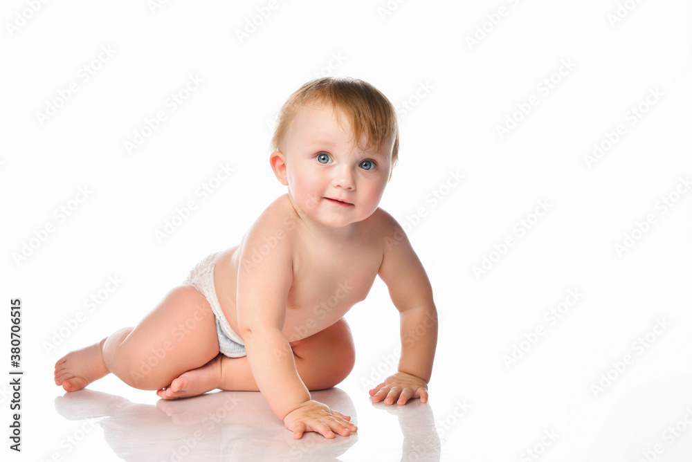 Portrait of a smiling little baby boy with blue eyes on a white background. Portrait of a smiling little baby boy with blue eyes on a white background.