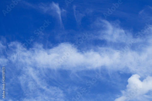 Blue sky with dramatic cumulus clouds.