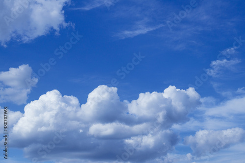 Blue sky with dramatic cumulus clouds. © andriikomashko