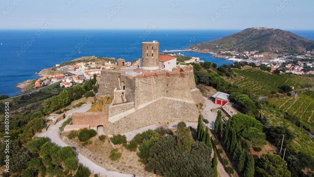Aerial view of the Fort Saint Elme above the town of Collioure and Port Vendres in the south of France - Star shaped medieval fortress built on a hilltop over the Mediterannean Sea