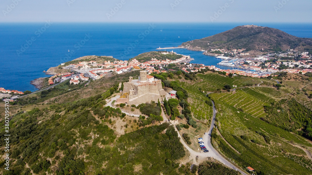 Aerial view of the Fort Saint Elme above the town of Collioure and Port Vendres in the south of France - Star shaped medieval fortress built on a hilltop over the Mediterannean Sea