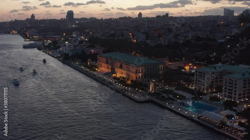 Beautiful Ciragan Palace Kempinski on Riverside of Bosphorus in Istanbul at Dusk, Aerial View photo