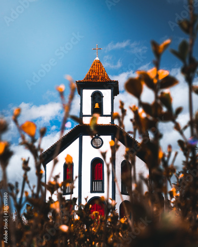 Small colonial church on a beautiful day with the sky as background Caeté, Minas Gerais, Brazil photo