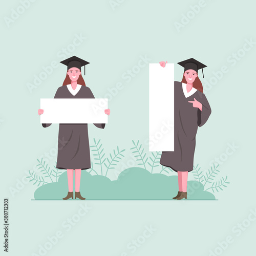 Woman graduate students holding a blank board.