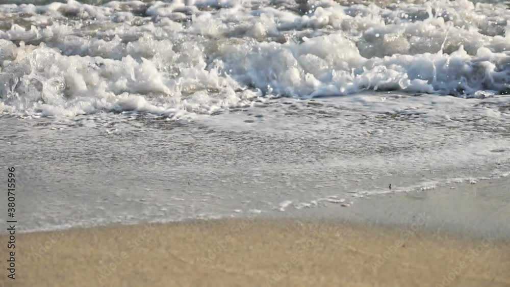 beach wave splashing macro in sunset beach wave splashing macro in sunset