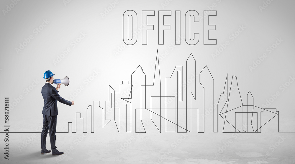 Businessman in hard hat holding blueprint with OFFICE inscription, engineering and architecture concept Businessman in hard hat holding blueprint with OFFICE inscription, engineering and architecture concept
