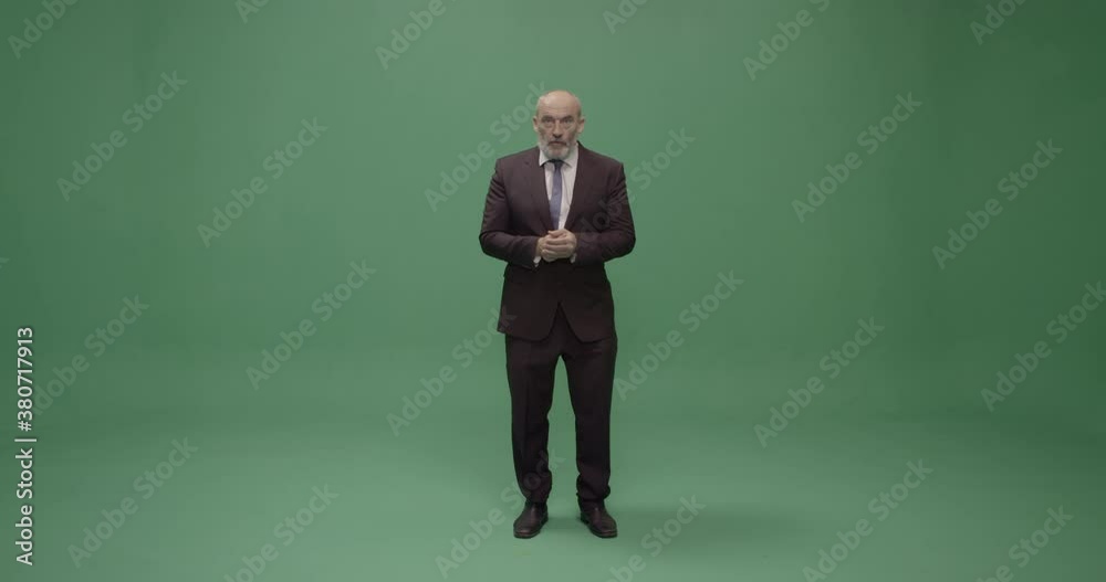 Studio, slow motion, mature lecturer responds to a question, London, UK Studio, slow motion, mature lecturer responds to a question, London, UK