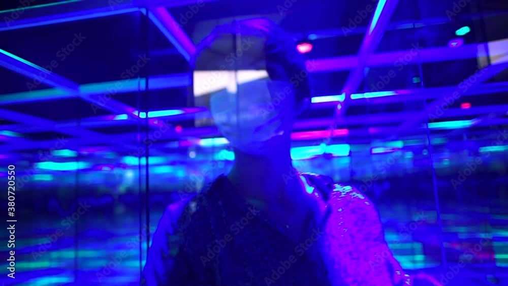 Visiting the mirror labyrinth during quarantine with the obligatory use of gloves and face masks. Search for a way out of the crisis. 