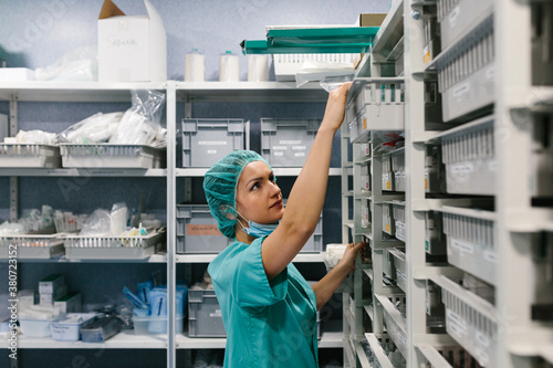 Nurse picking medicines from the warehouse boxes