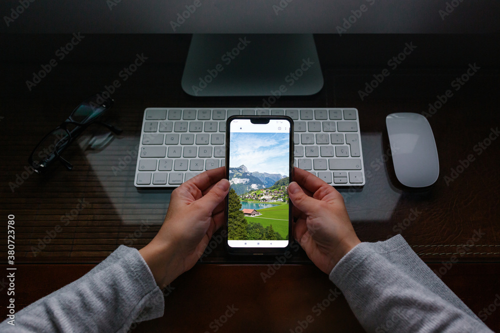 © MyMicrostock/Stocksy - Anonymous woman telecommuting at home while looking at vacation © MyMicrostock/Stocksy - Anonymous woman telecommuting at home while looking at vacation