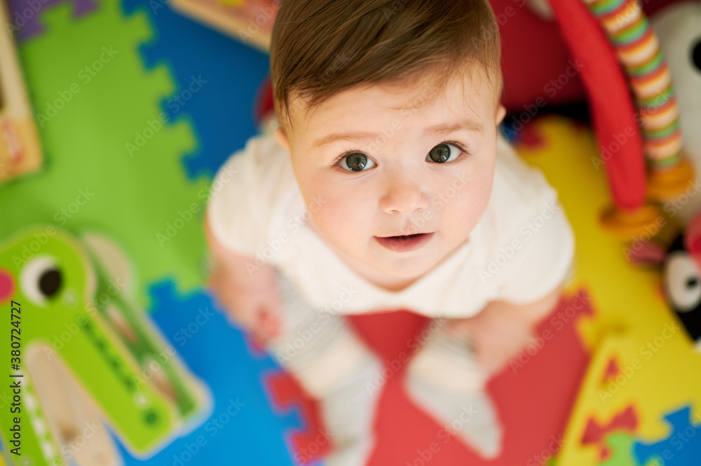 Happy baby playing with colorful toys Happy baby playing with colorful toys