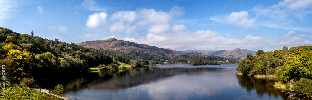 Panoramic view from the waters edge of Grasmere Lake in the Lake District, Cumbria, UK Panoramic view from the waters edge of Grasmere Lake in the Lake District, Cumbria, UK