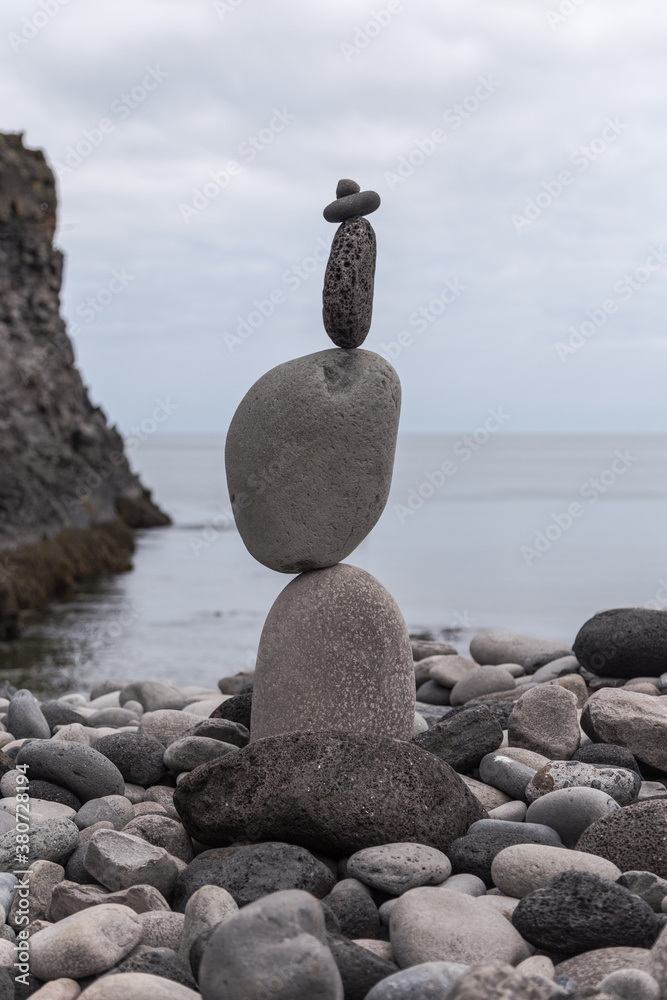 A gravity defying cairn on a beach in Iceland A gravity defying cairn on a beach in Iceland