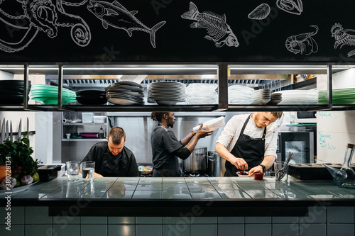Multiethnic cooks in a restaurant's kitchen