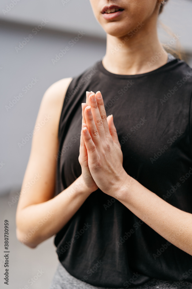 Woman doing anjali mudra Woman doing anjali mudra
