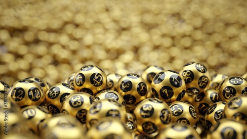 golden lottery balls covered ground with bokeh on background. 3D illustration with copy space. suitable for lottery, bingo and luck themes. photo