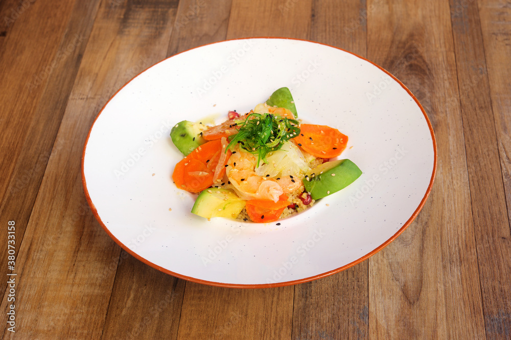 vegetable salad and fish on wooden background. Top view vegetable salad and fish on wooden background. Top view