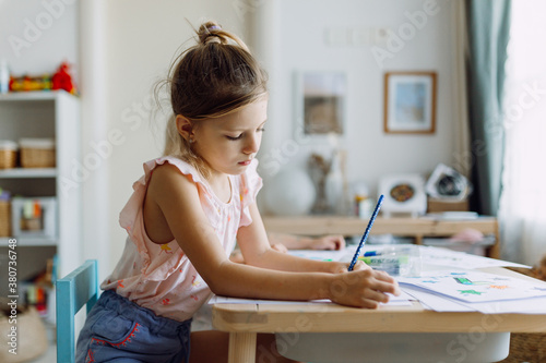 A girl coloring at home photo