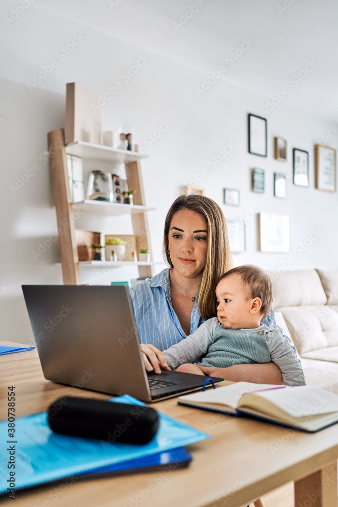 Family with baby working at home Family with baby working at home