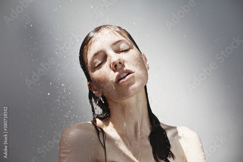 Young sensual woman in shower, Rain photo