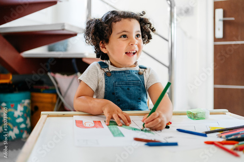 Mixed race child home schooling photo