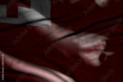 cute celebration flag 3d illustration. - illustration of dark Tonga flag with folds lying flat in shadows with light spots on it