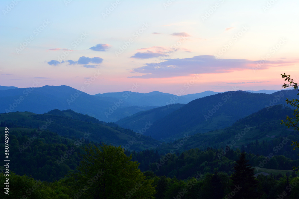 Colorful blue sunset on top of Ukrainian mountains. Carpathians, Synevir. Nature background