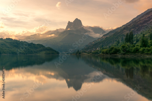 Breathtaking scenery of mountain ridge and calm lake in summer