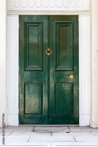 Elegant dark green wooden front door in London