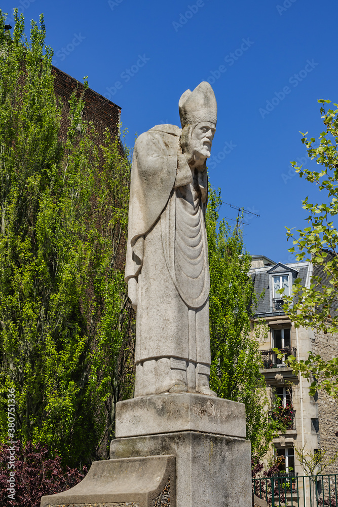 Statue of Saint Denis (first of Paris) holding his own head