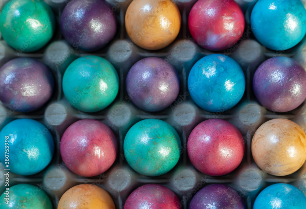 Easter background with hand painted purple, blue, green, orange Easter background with hand painted purple, blue, green, orange