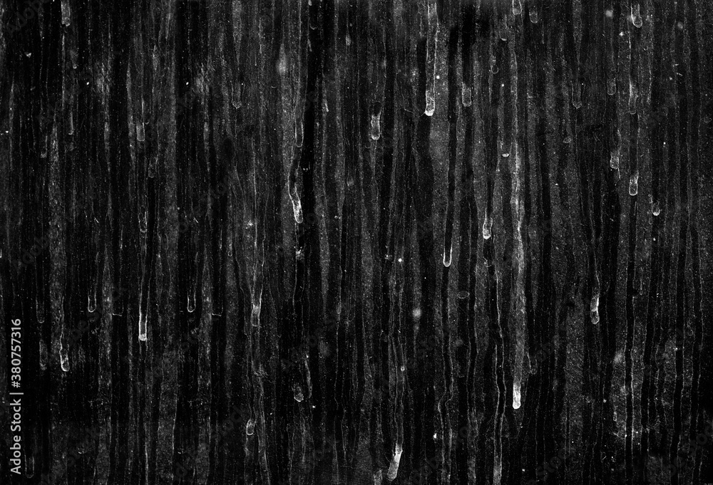 Real dirty glass with dust, dirt and rain stains isolated on a black