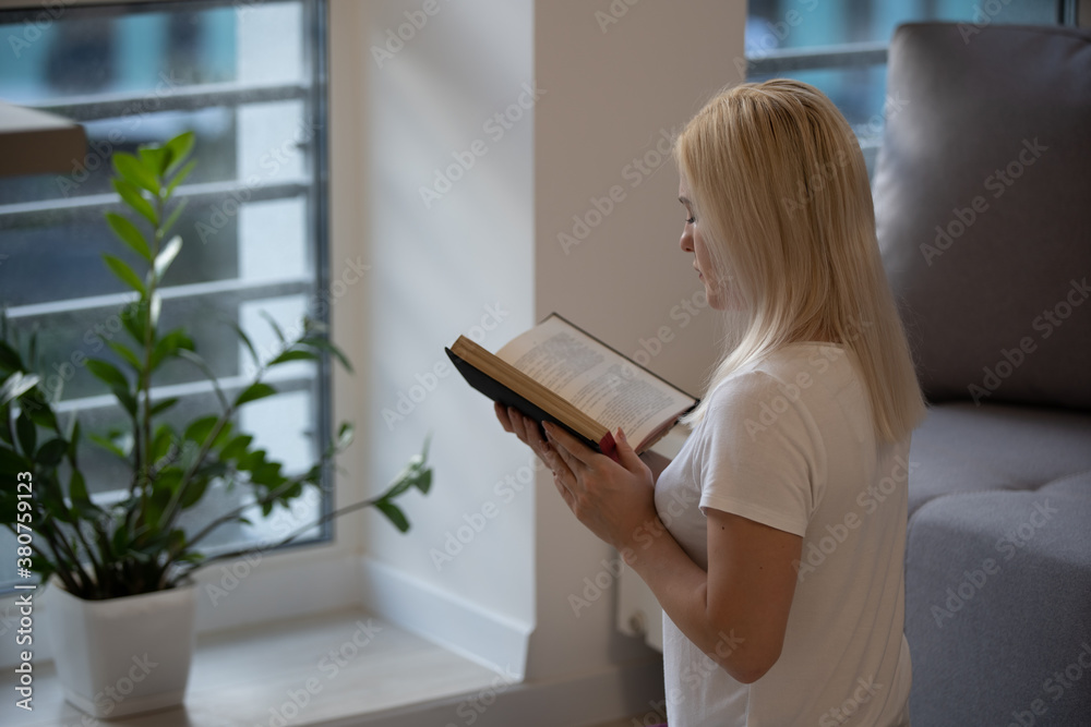 woman praying on holy bible in the morning. woman hand with Bible praying, concept for faith, spirituality and religion. Social distancing. woman praying on holy bible in the morning. woman hand with Bible praying, concept for faith, spirituality and religion. Social distancing.