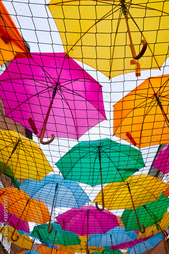 Funny colorful umbrella decoration photographed from below.