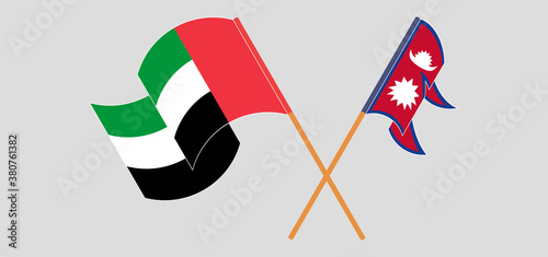 Crossed and waving flags of Nepal and the United Arab Emirates