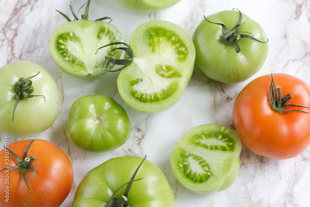 Green and orange tomatoes Green and orange tomatoes