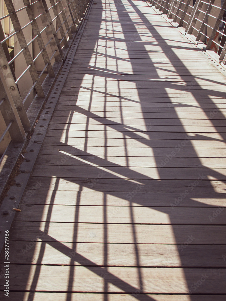 Shadow of Southbank footbridge handrail. It is named after Evan Walker, a notable architect and member of VIC parliament. Suitable for publication background or to illustrate an article about a bridge Shadow of Southbank footbridge handrail. It is named after Evan Walker, a notable architect and member of VIC parliament. Suitable for publication background or to illustrate an article about a bridge