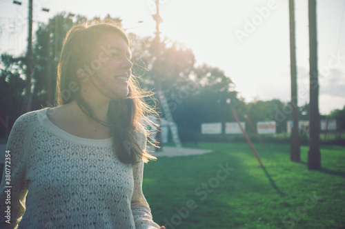 Portair of smiling girl in the wind photo