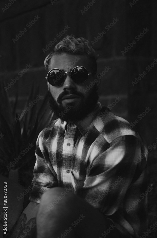 Man in plaid shirt and sunglasses Man in plaid shirt and sunglasses