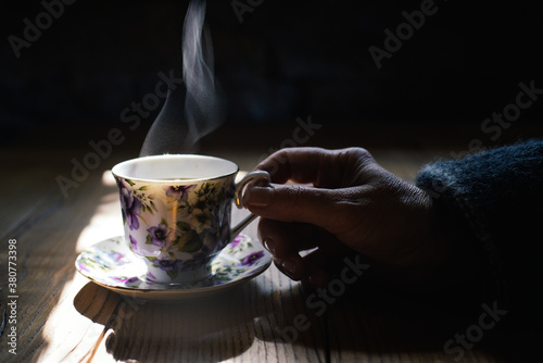 Drink: hand holding a cup of coffee photo