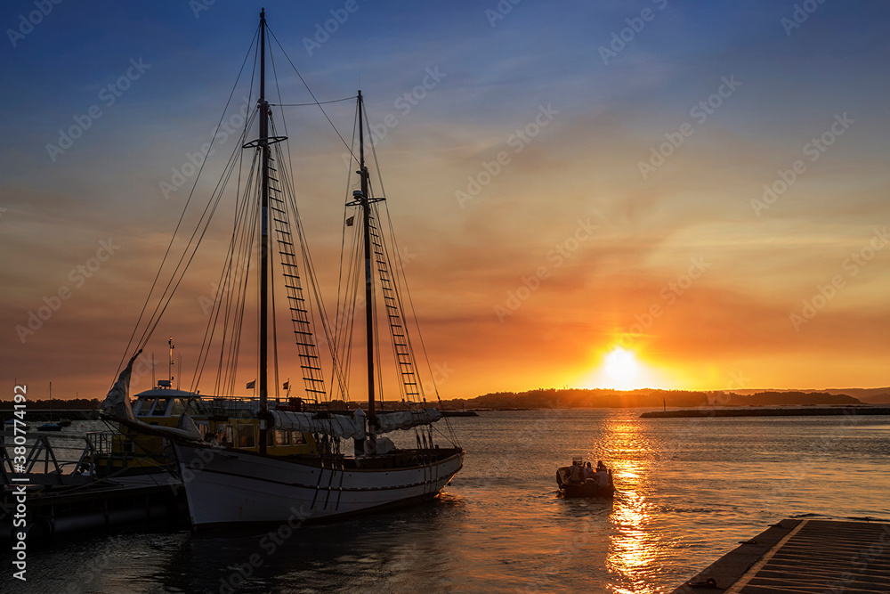 Moored sailboat at sunset