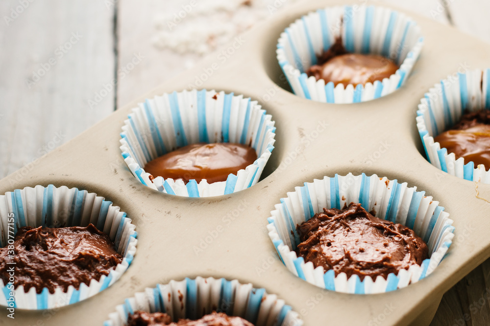 Double chocolate and salted caramel muffins ready for baking Double chocolate and salted caramel muffins ready for baking