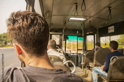 Man watching through the window, interior bus. Egypt 2018
