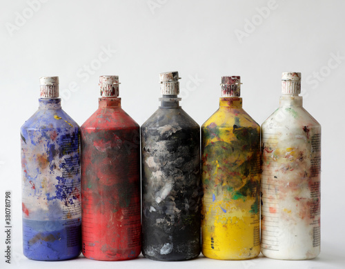Old and dirty gouache paint bottles